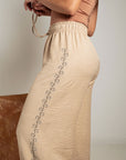 PANTALÓN PALAZO BRILLO LATERAL