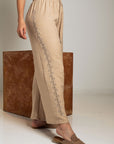 PANTALÓN PALAZO BRILLO LATERAL